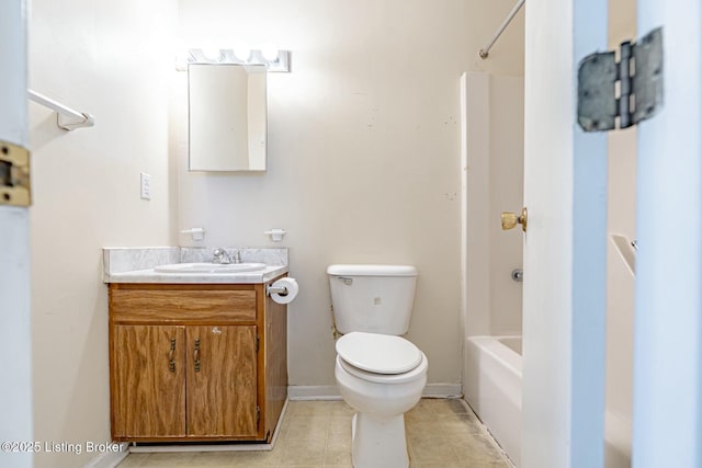 bathroom with baseboards, toilet, tile patterned flooring, tub / shower combination, and vanity