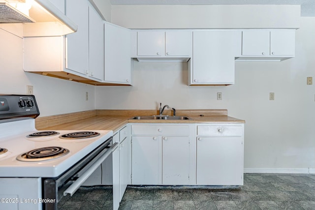 kitchen featuring light countertops, white electric range, a sink, and white cabinetry