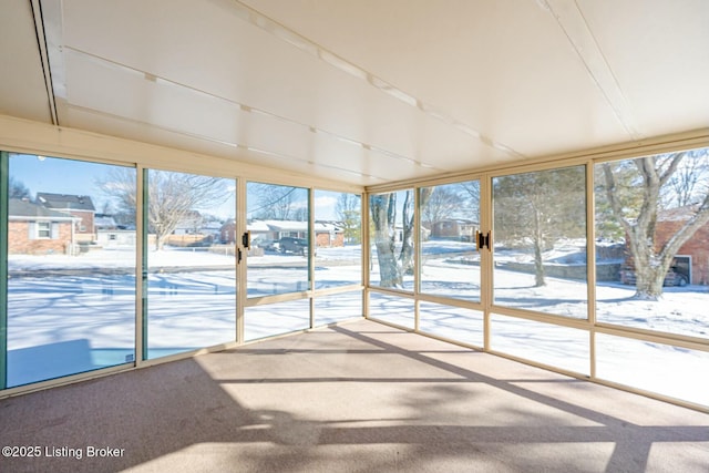 unfurnished sunroom with plenty of natural light