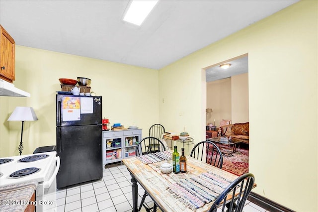 dining area featuring light tile patterned floors