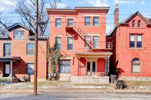 view of front of property featuring french doors and brick siding