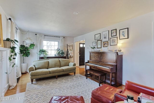 living room featuring wood finished floors and baseboards