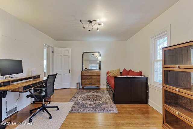 home office featuring light wood-style floors and baseboards