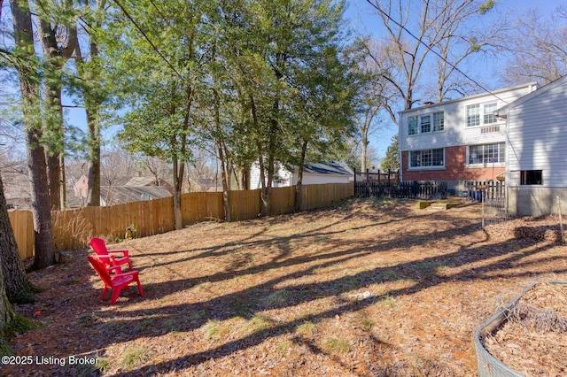 view of yard with a fenced backyard