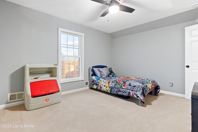 carpeted bedroom with ceiling fan, visible vents, and baseboards