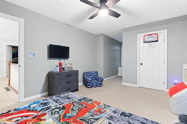 bedroom with baseboards, visible vents, and light colored carpet