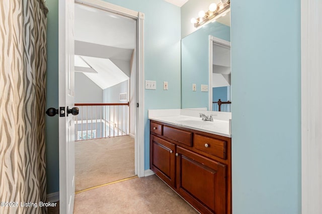 bathroom with vanity and baseboards