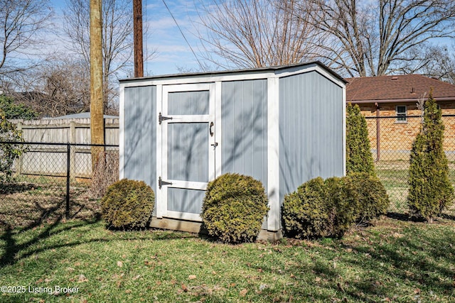 view of shed with a fenced backyard