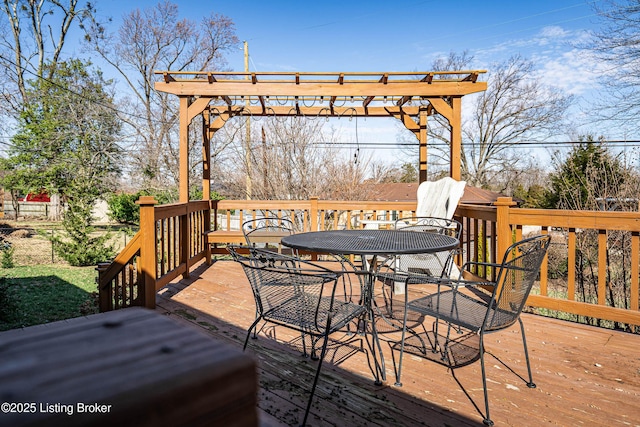 wooden terrace with outdoor dining space and a pergola