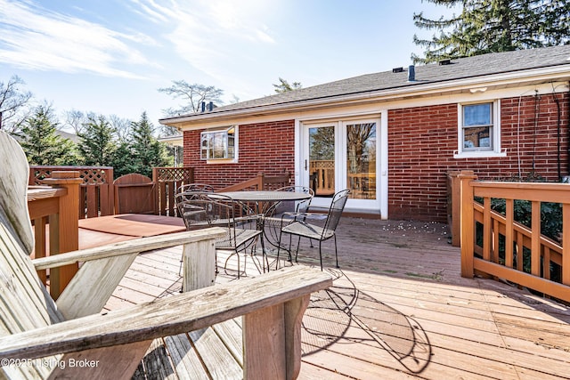 wooden deck with outdoor dining area