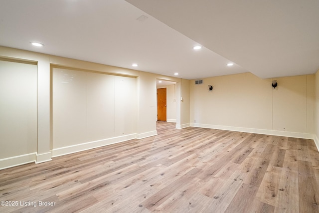 spare room featuring recessed lighting, baseboards, visible vents, and light wood finished floors