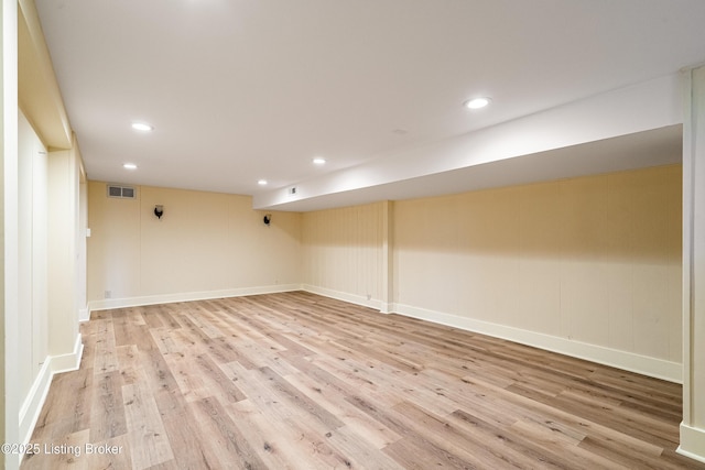 empty room featuring recessed lighting, baseboards, visible vents, and light wood finished floors