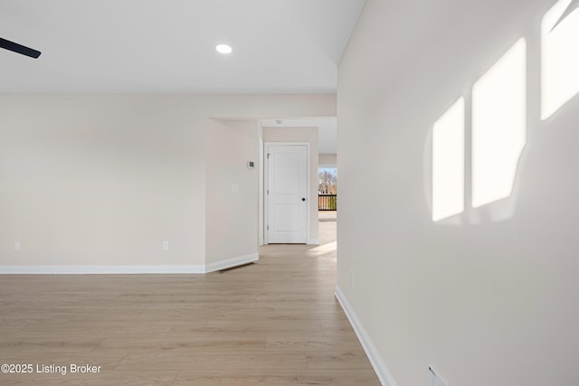 hallway featuring baseboards, recessed lighting, visible vents, and light wood-style floors