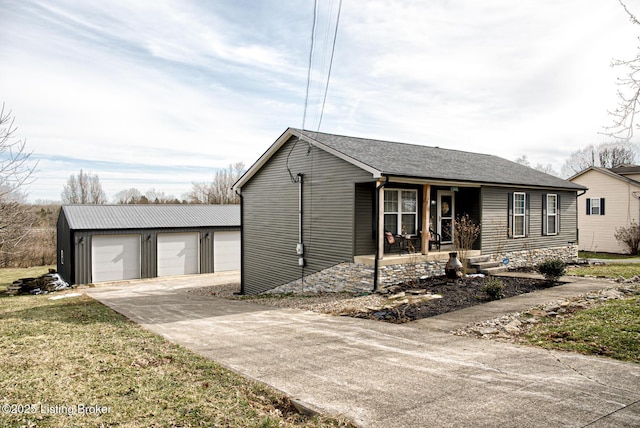 single story home with a porch and an outdoor structure