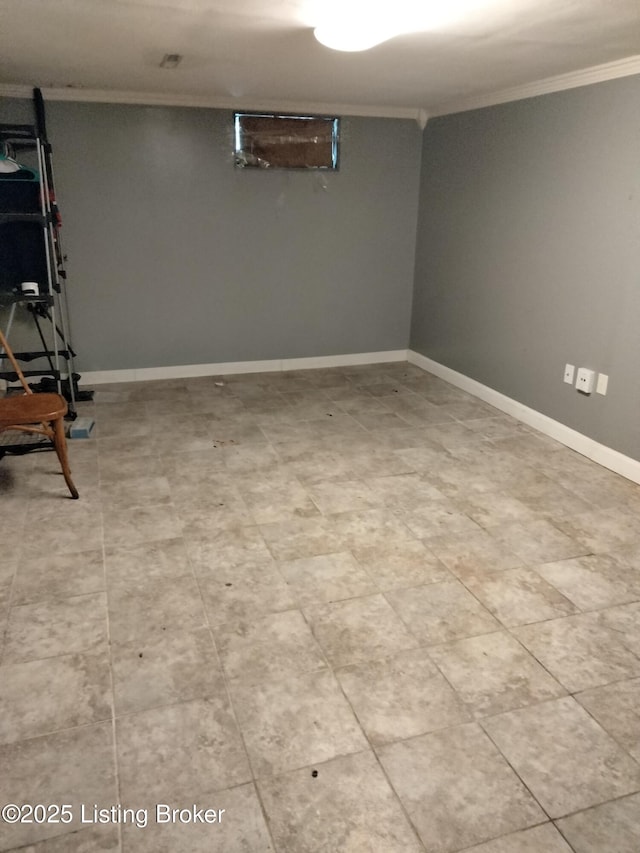 finished basement with baseboards and ornamental molding