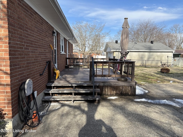 wooden deck featuring fence