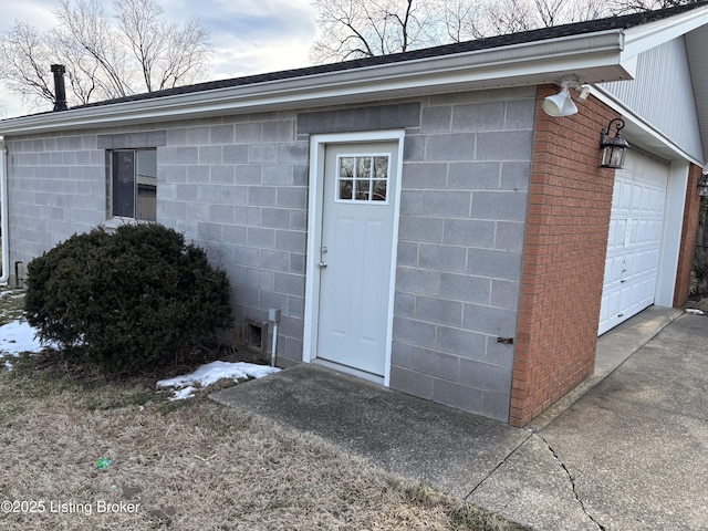 property entrance with concrete block siding