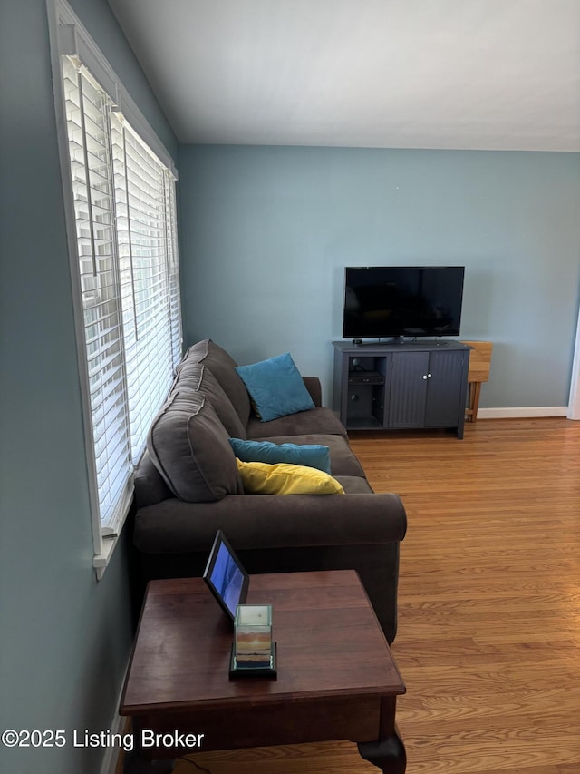 living room with wood finished floors and baseboards