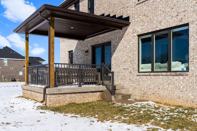 exterior space featuring brick siding