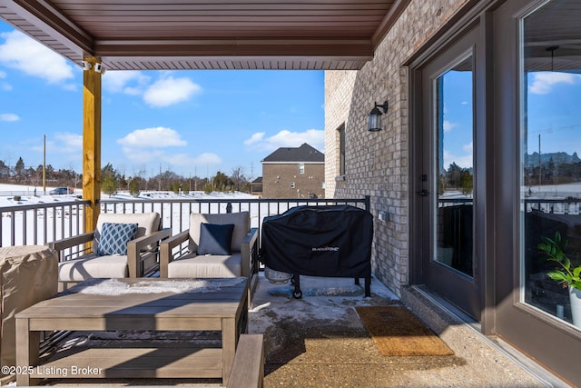 view of patio featuring a balcony and grilling area