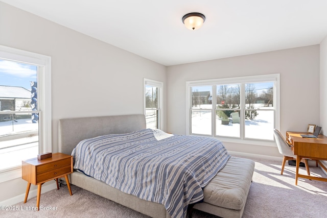 bedroom featuring carpet flooring and baseboards