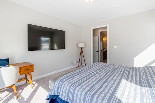 bedroom with light carpet and baseboards