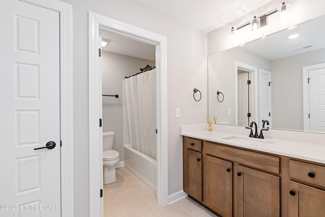 full bathroom featuring visible vents, toilet, shower / bath combo with shower curtain, vanity, and tile patterned flooring