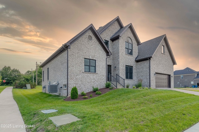 1431 Swan Creek Pl, Louisville, KY 40299 - french provincial home featuring brick siding, concrete driveway, a lawn, and central AC