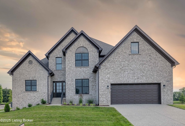 1431 Swan Creek Pl, Louisville, KY 40299 - french country style house with a lawn, driveway, an attached garage, and brick siding