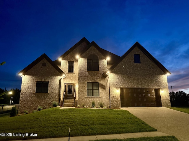 1431 Swan Creek Pl, Louisville, KY 40299 - french provincial home with concrete driveway, a front yard, and brick siding