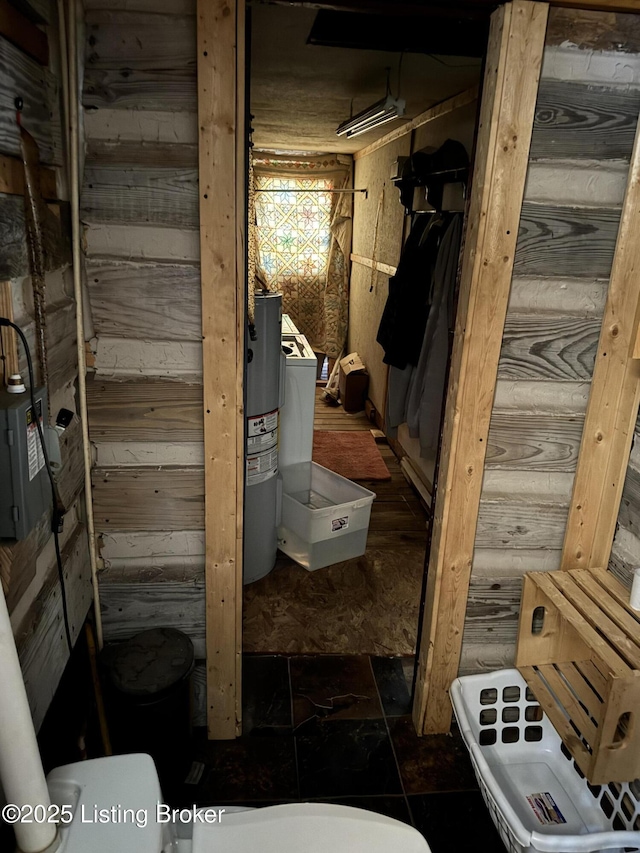 bathroom featuring wood walls