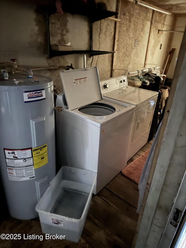 clothes washing area with laundry area, electric water heater, independent washer and dryer, and dark wood-style flooring