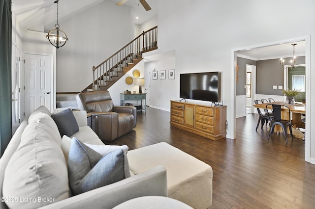 living room featuring high vaulted ceiling, ornamental molding, dark wood-style flooring, and stairway