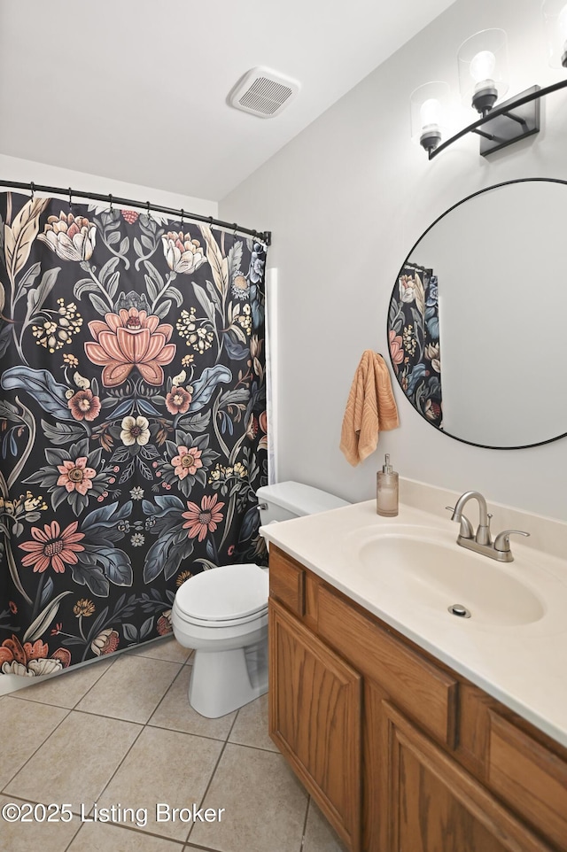 full bath with visible vents, vanity, toilet, and tile patterned floors