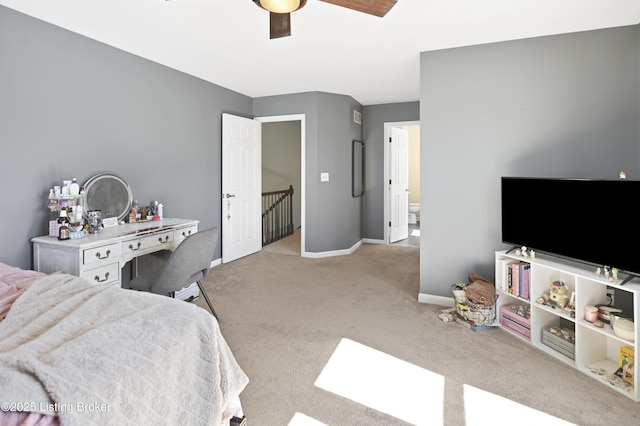 bedroom with light carpet, ceiling fan, and baseboards