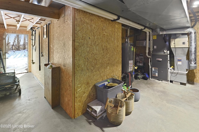 basement featuring heating unit and gas water heater