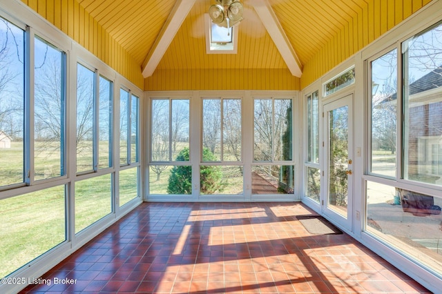 unfurnished sunroom with vaulted ceiling with beams and a ceiling fan