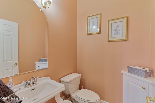 bathroom with a sink and toilet