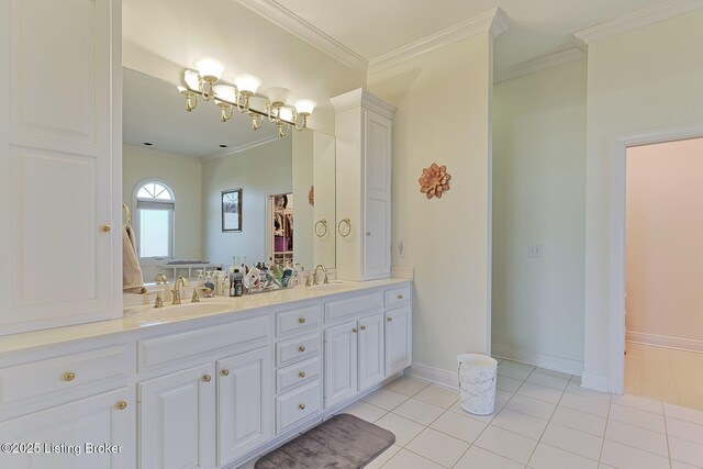 full bathroom featuring crown molding, a sink, and tile patterned floors