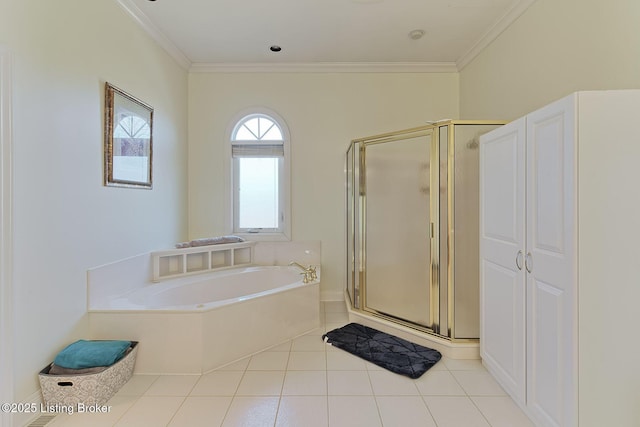 bathroom featuring a stall shower, tile patterned flooring, a garden tub, and crown molding