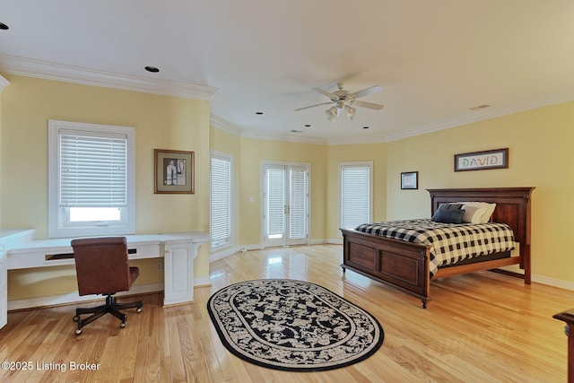 bedroom with crown molding, baseboards, built in study area, and light wood-style floors