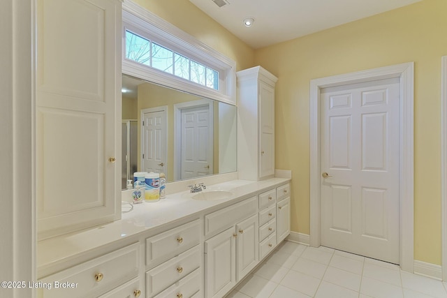 full bathroom with baseboards, visible vents, vanity, and tile patterned floors