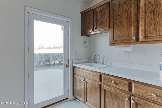 kitchen with light countertops and a sink