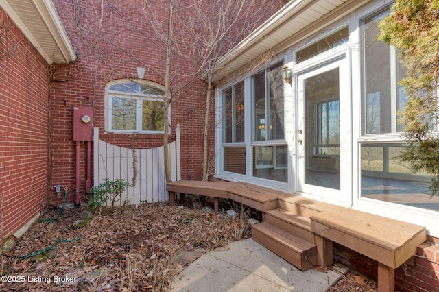 view of side of property featuring brick siding