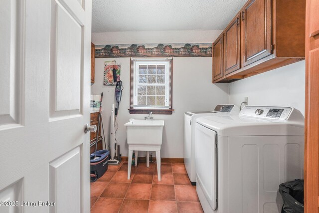 950 Lakeview Dr, Bloomfield, KY 40008 - clothes washing area with tile patterned flooring, baseboards, washer and clothes dryer, cabinet space, and a textured ceiling