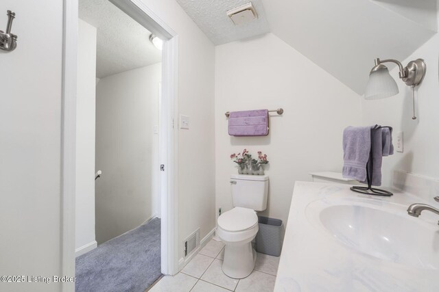 950 Lakeview Dr, Bloomfield, KY 40008 - bathroom featuring visible vents, vaulted ceiling, a textured ceiling, tile patterned floors, and toilet