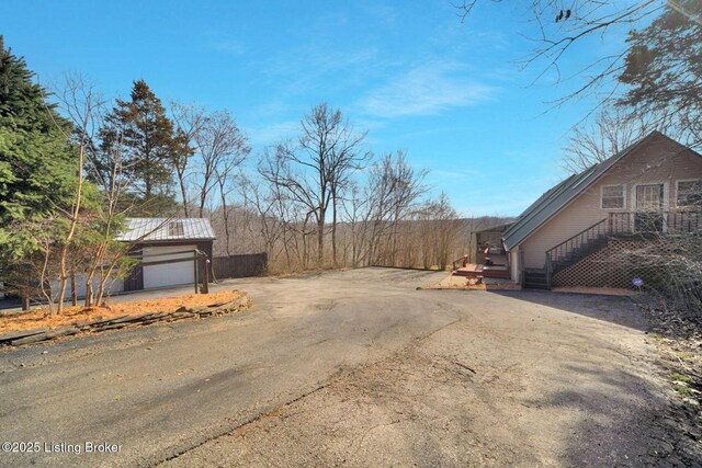 950 Lakeview Dr, Bloomfield, KY 40008 - exterior space with aphalt driveway and a garage