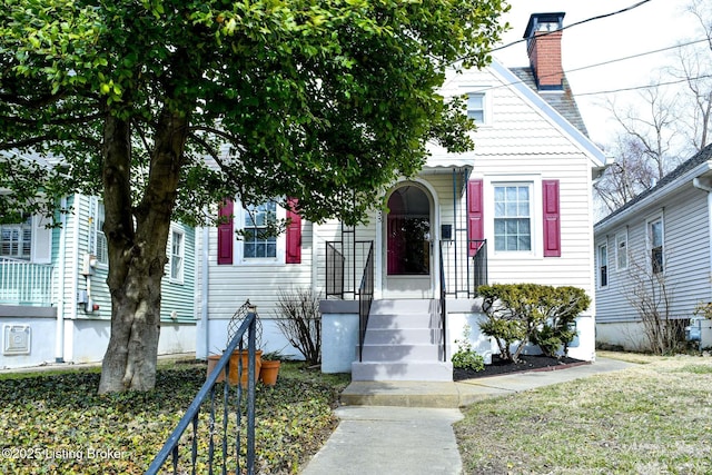 view of front of home with a chimney