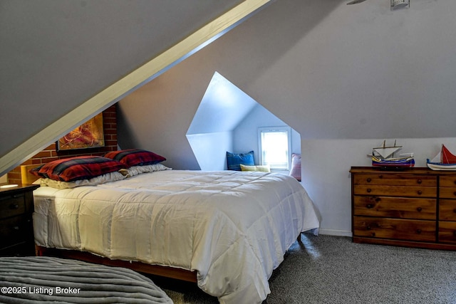 bedroom with vaulted ceiling and dark carpet