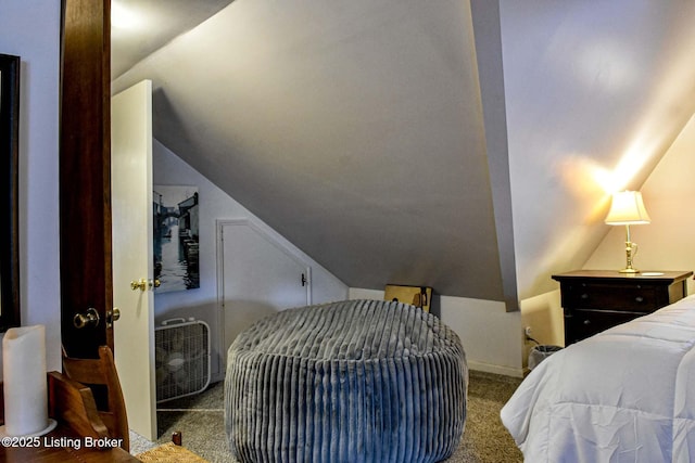 carpeted bedroom with vaulted ceiling